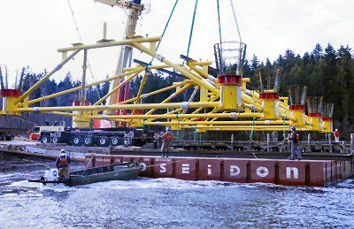 THE BIG LIFT. A 500-ton crane lifts onto a barge at Deep Cove in Eastport the 96-000-pound base support frame for Ocean Renewable Power Company's first grid-connected, commercial TidGen Powe