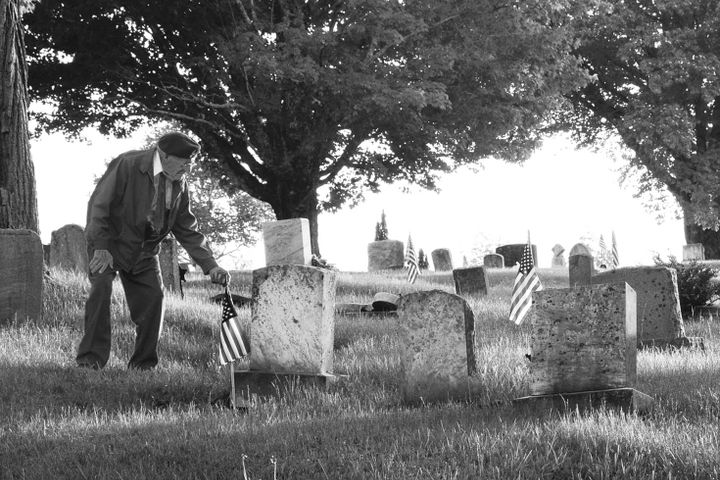 EDWARD BROWNE, who passed away on December 22, 2020, at the age of 101, is shown placing flags at the graves of veterans at the Dennysville Cemetery before Memorial Day in May 2010. He serve