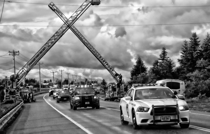 A PROCESSION of police, fire and ambulance vehicles brought Eastport Police Chief Andrew Little home, greeted by the crossed ladders of the Eastport and Pleasant Point fire trucks on the cau