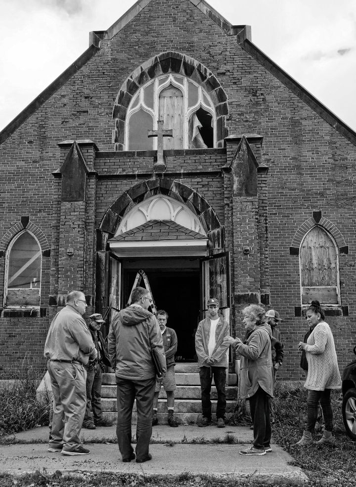 MAKING A LAST-DITCH APPEAL to save St. Ann's Church at Sipayik from being torn down is Hilda Soctomah Lewis, second from right, to representatives of the Roman Catholic Diocese of Portland o