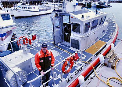 PROUD of Coast Guard Station Eastport's new 45-foot Response Boat-Medium is Chief Austin Olmstead, officer in charge of the station. (Edward French photo)
