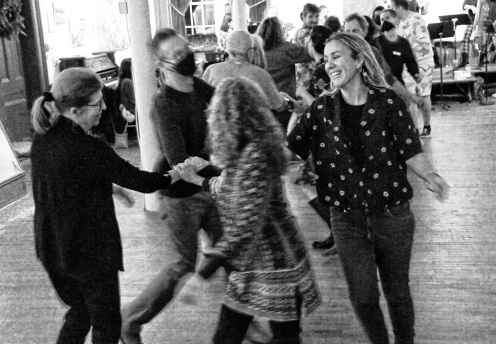 SPINNING WITH WINTRY WARMTH is a lively crowd at the MICE (Moose Island Contra Etc.) band's first contra dance at the Eastport Arts Center on January 28. The contra dance drew people from ne