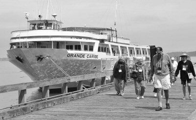 VISITORS from the cruise ship Grande Caribe, which docked at the Eastport fish pier on Friday morning, August 3, prepare to explore the city. (Don Dunbar photo)