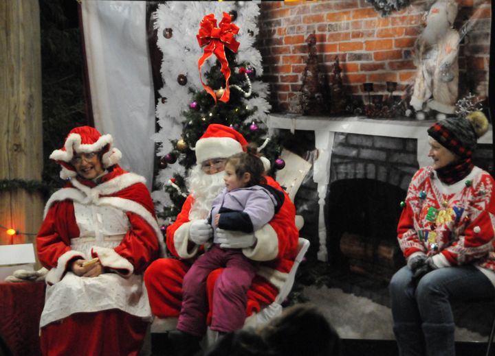 SANTA heard the wishes from many children at Triangle Park in Calais following the Christmas parade sponsored by the Calais Lioness Club on December 2. (Edward French photo)