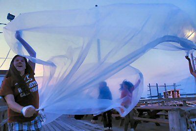 THE CHOREOGRAPHED waving of sheets is enjoyed by some enthusiastic participants in the True East Magnet to the Breakwater Parade, which was held in Eastport on June 15. (Edward French photo)