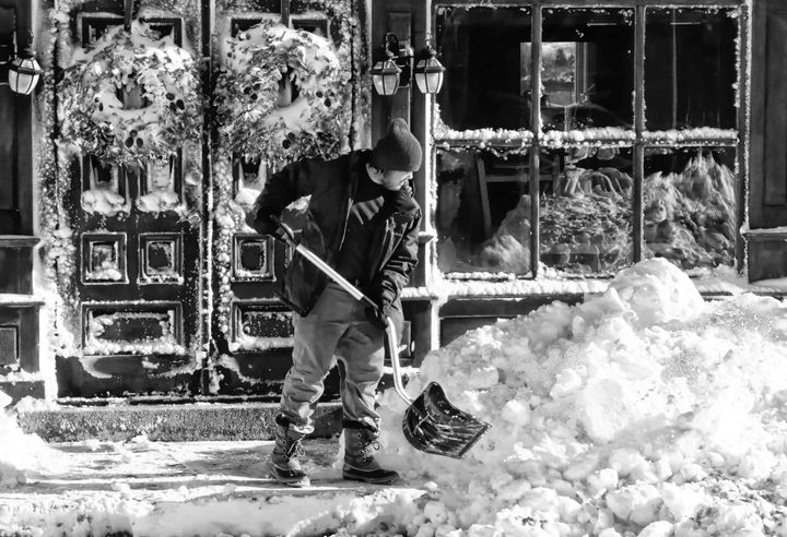 SHOVELING OUT in front of Horn Run Brewing in downtown Eastport is Kieran Weston, following the January 7 storm that dumped more than a foot of snow on the island city. (Edward French photo)