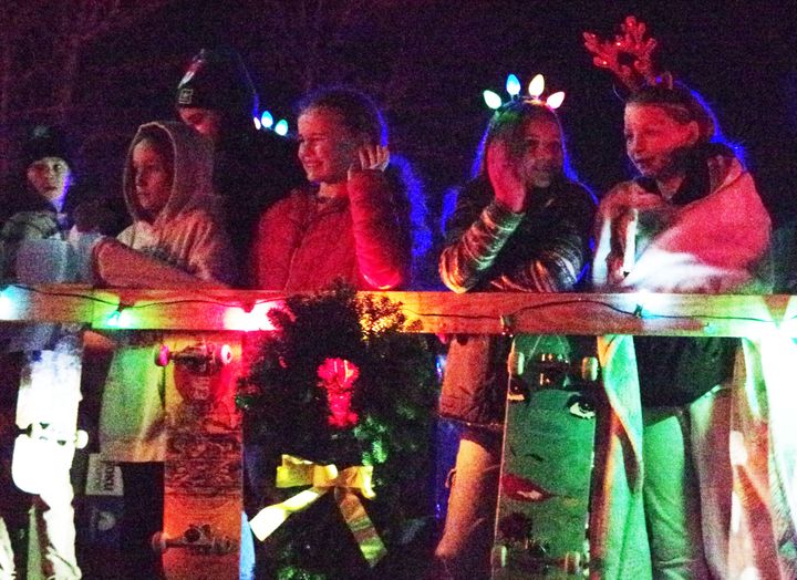 SPREADING GOOD CHEER. These young girls on the Calais Skatepark Committee float were having a good time during the Calais Lioness Christmas Parade on December 1. See this issue for more phot