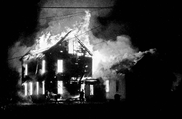 AN EARLY-MORNING FIRE destroyed the Unitarian Meeting House and parsonage in Eastport on October 26. (Quoddy Tides photo)