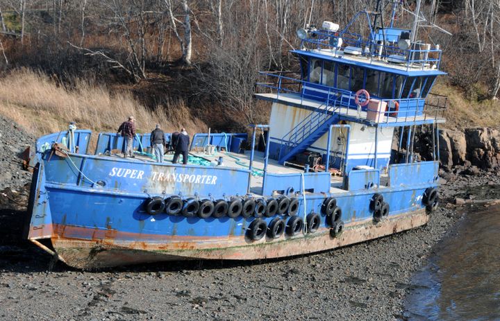 HIGH AND DRY. During strong winds on an extreme high tide on November 27, the 98-foot steel hull vessel Super Transporter became detached from its mooring in Broad Cove, Eastport, and was bl