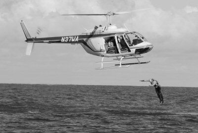 A GOOD DAY FOR A SWIM. Sam Tickle jumps from a helicopter into the waters of the Grand Manan Channel on October 14 as part of a documentary being filmed about an athlete accomplishing 30 spo