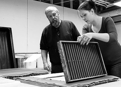 COMPLETING A SUCCESSFUL RUN at making her first sheet of handmade paper is one of the participants of the March 2 Hiraeth: Recovery through the Arts workshop at the University of Maine at Ma