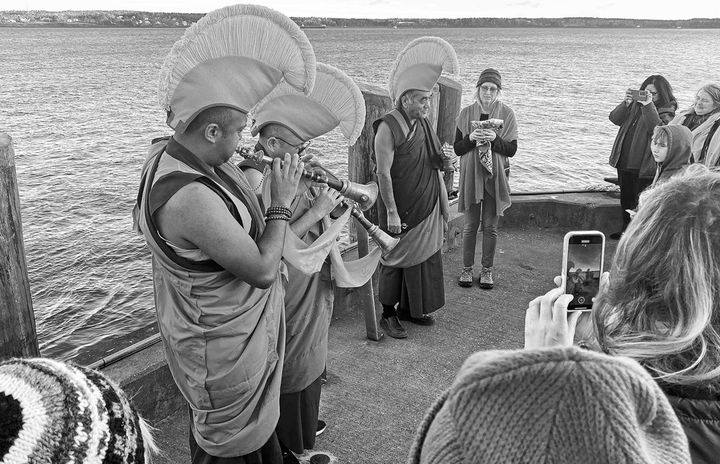 BUDDHIST MONKS from the Ngari Institute of Ladakh, India ' Venerable Lobsang Damchoe, Rigzin Wangdu and Geshe Tsewang Dorje ' are seen with community members on the fish pier on Sunday, Nove