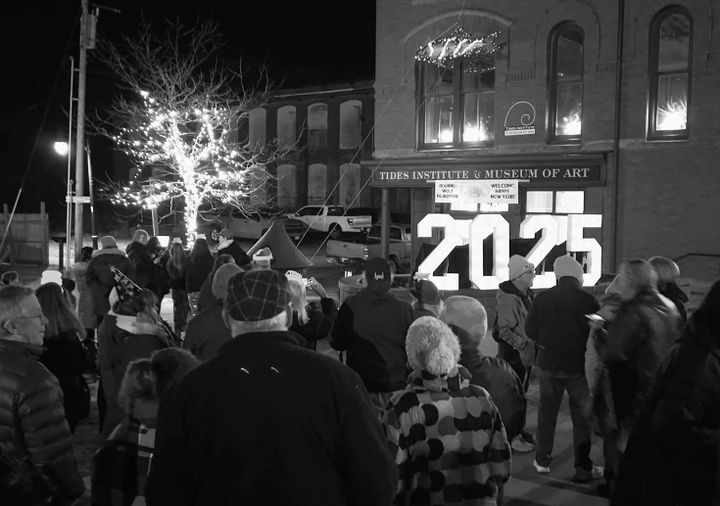 A LARGE CROWD awaits the Sardine Drop at the Tides Institute & Museum of Art building in Bank Square, Eastport, on New Year's Eve. See article about the Sardine and Maple Leaf drops in this 