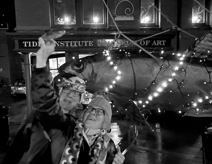 POSING FOR A SELFIE with the sardine during the 18th Great Sardine & Maple Leaf New Year's Eve celebration in Eastport are Mike Stewart and Amy Ray of Eastport. The annual event is organized