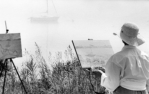 ARTIST - PAINTING - BOAT IN FOG. Bonnie Foster of Voorheesville, N.Y., is among the students taking a course taught by artist Jim Salem of Eastport. It is one of the offerings of the Eastpor