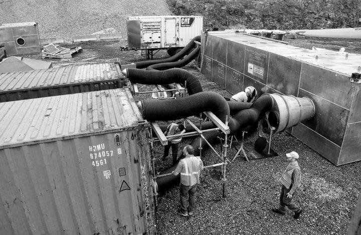 TWO CONTAINERS of wood chips are hooked up for phytosanitation using the heat-treatment units at the Estes Head port terminal in Eastport. The operation, conducted at the end of July, was th