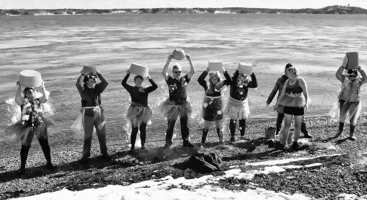 DUMPING BUCKETS OF SNOW over their heads are a group of nine polar bear 'dippers' gathered at a small beach in Eastport's South End on March 5. They were there to support the Ronald McDonald