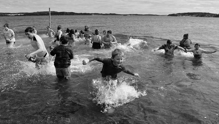 COMING OUT of the bay during the Polar Bear Dip at Split Rock, Sipayik, on March 10 was a crowd of dippers. Over $12,300 has been raised so far in the annual fundraiser, with more donations 