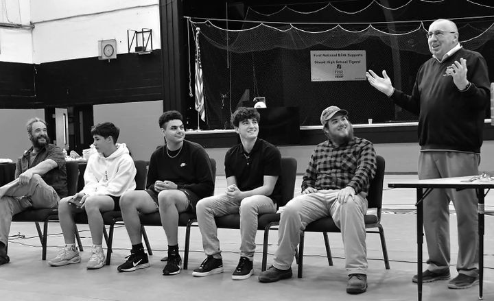 SHEAD PRINCIPAL PAUL THERIAULT (right) speaks during the reception honoring the Shead Jazz Quartet. Left to right are music instructor Robert Sanchez, Ellis Zipperer-Sanchez, Antonio Vizcarr