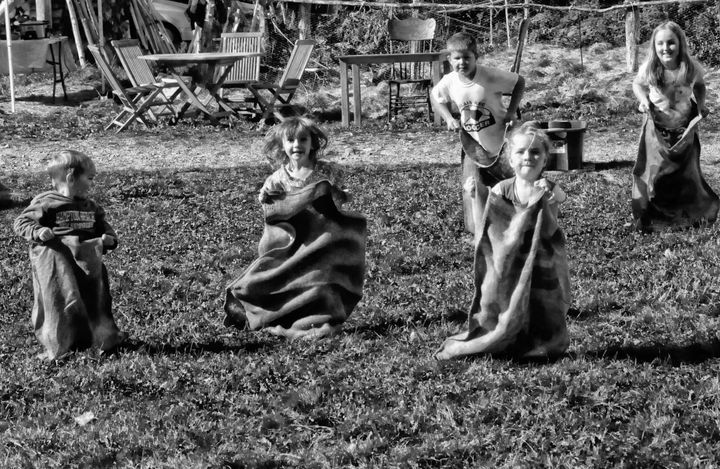 JUMPING INTO FALL with a sack race are these children at the fall festival held by Hope's Haven farm in Pembroke on October 8. (Edward French photo)