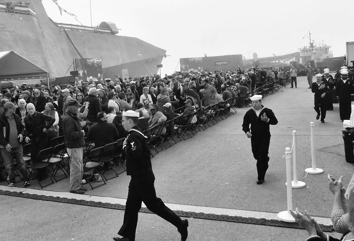 RUNNING ON BOARD to bring the USS Augusta to life during the commissioning ceremony on September 30 are the ship's sailors. The historic event at the Eastport breakwater drew 1,600 people. (