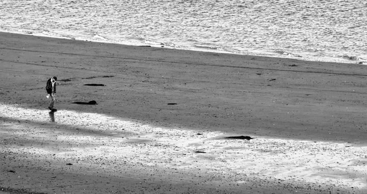 WALKING ALONG the sands of time at Prince's Cove, Eastport, on an April afternoon. (Edward French photo)