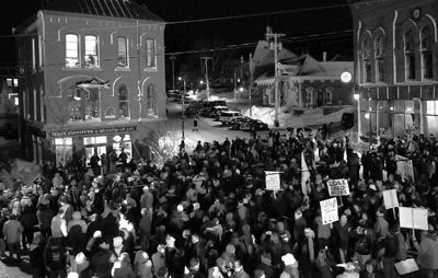 COUNTING DOWN TO THE NEW YEAR. A large crowd watches in Bank Square, Eastport, as the giant sardine descends at midnight from the third story of the Tides Institute & Museum of Art on New Ye