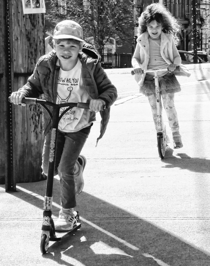 HAVING FUN on their scooters on a spring day in Eastport are Teddy Bishop, 7, and his sister Frances, 5, of Seal Cove, Maine. They were visiting their grandparents, Bob and Jeanne Peacock, i