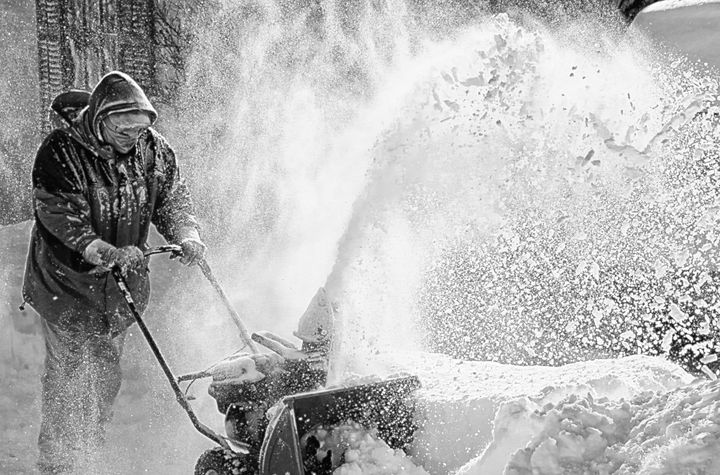 LET IT SNOW! Mike Garvin clears his Key Street driveway in Eastport following the snowstorm of February 8. Six days earlier, the groundhog Punxsutawney Phil saw his shadow and declared there