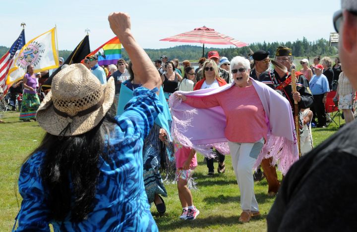 SALUTING veterans, including Madonna Soctomah, a U.S. Navy Medical Corps veteran, during the veterans honor song at the ceremonial dances is former Chief Vera Francis. (Edward French photo)