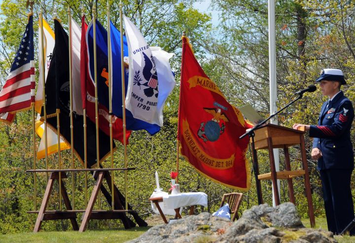 WITH FLAGS FLUTTERING