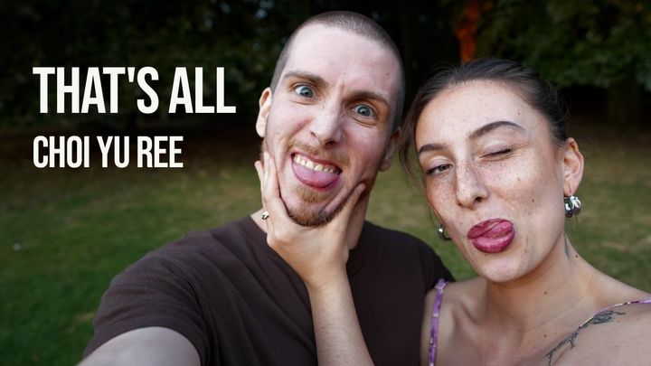 A selfie of Slim B (left) and Todz (right) in a park. Slim B is holding the camera and Todz is squeezing Slim B's chin.