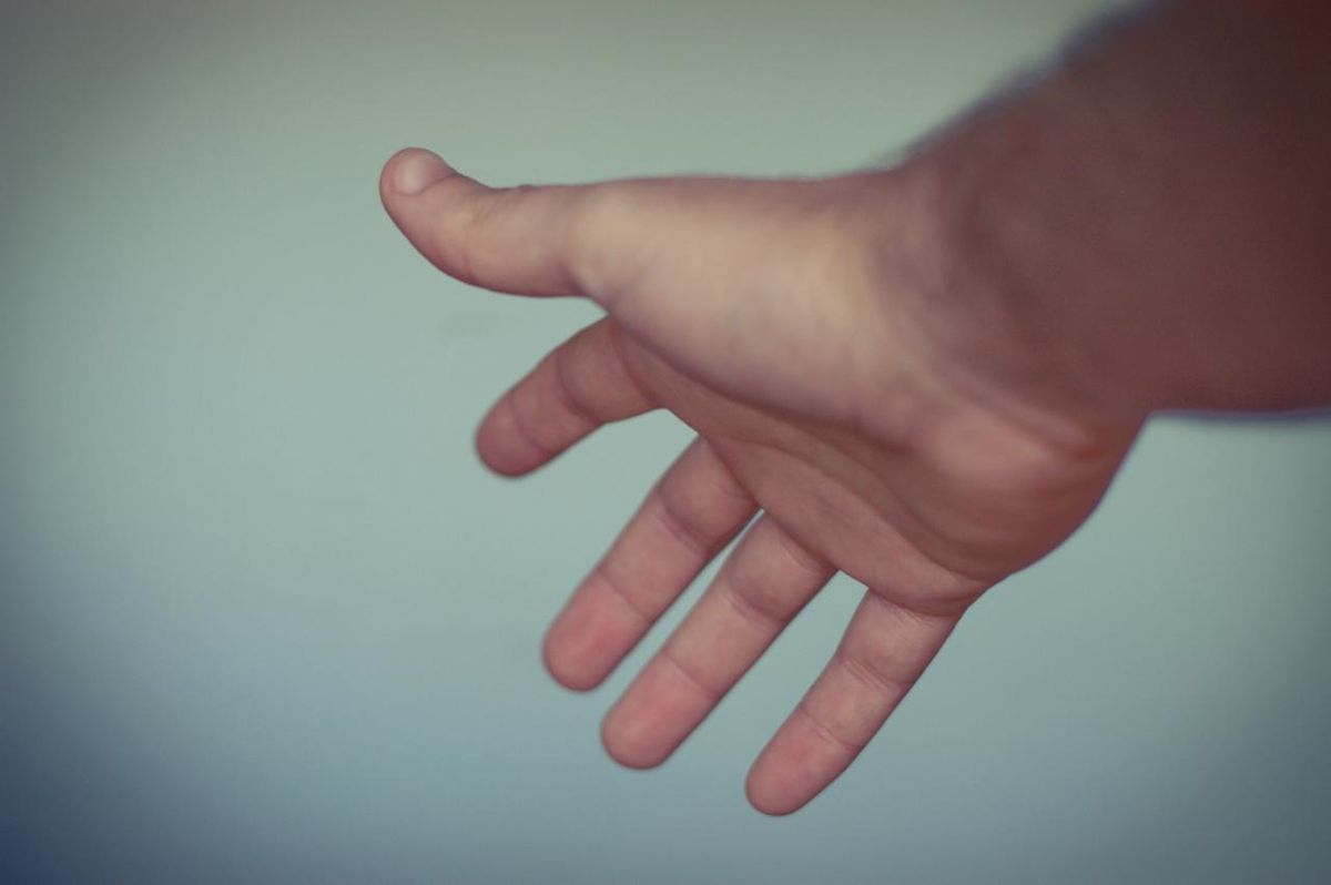 protect ears and hearing from loud noise using hands