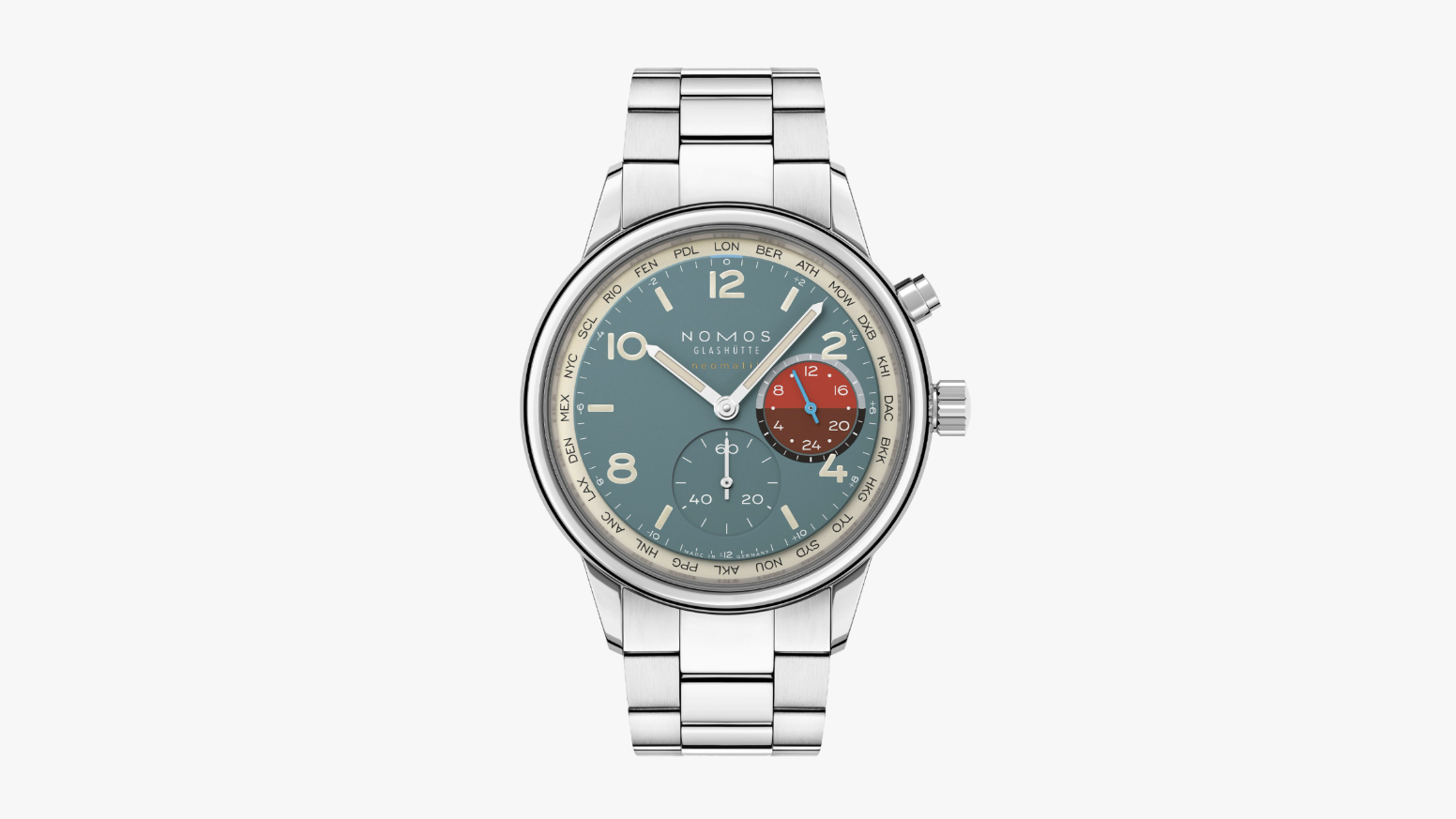 The new Nomos Club Sport Neomatik Worldtimer with blue-green dial, red sub-dial, and stainless steel bracelet, photographed on a light surface.