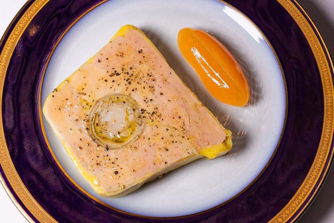 Pâté-style terrine served with olive oil and seasoning at Le Chêne, a modern French restaurant in New York City.