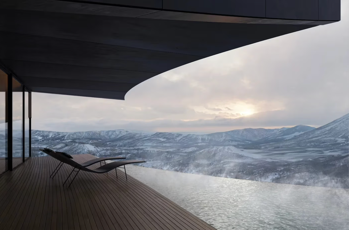 Contemporary architectural retreat with curved roof and panoramic mountain views