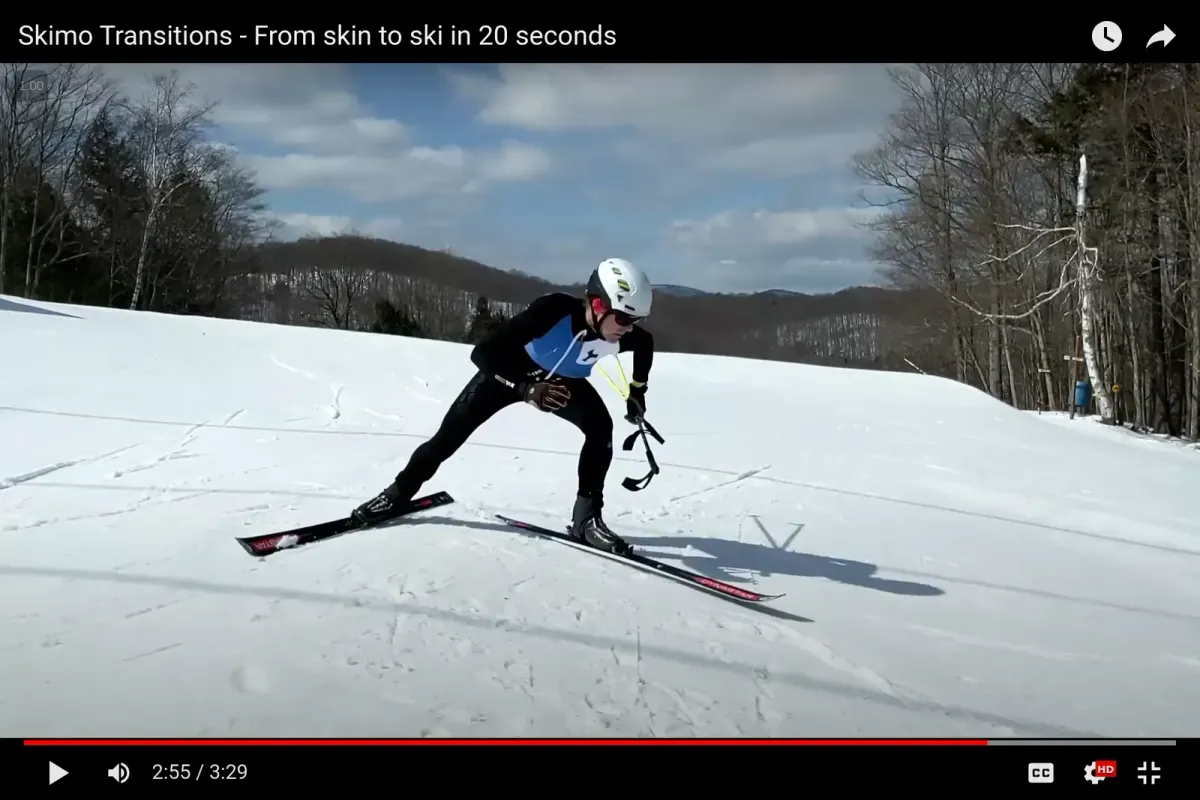 A photo of a skimo racer exiting an upper transition