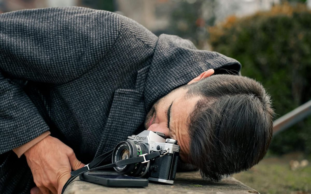 Photographer Capturing Urban Scene Outdoors