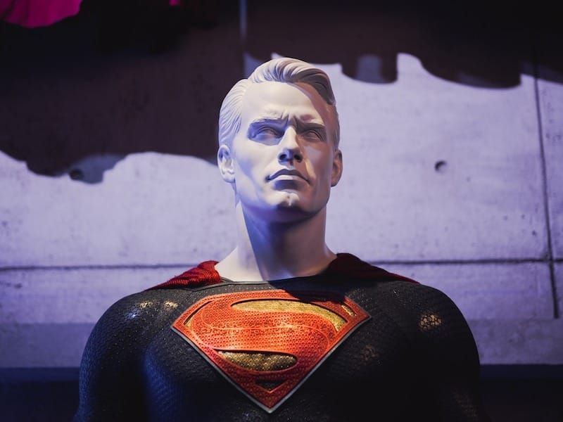 a statue of a man in a superman suit