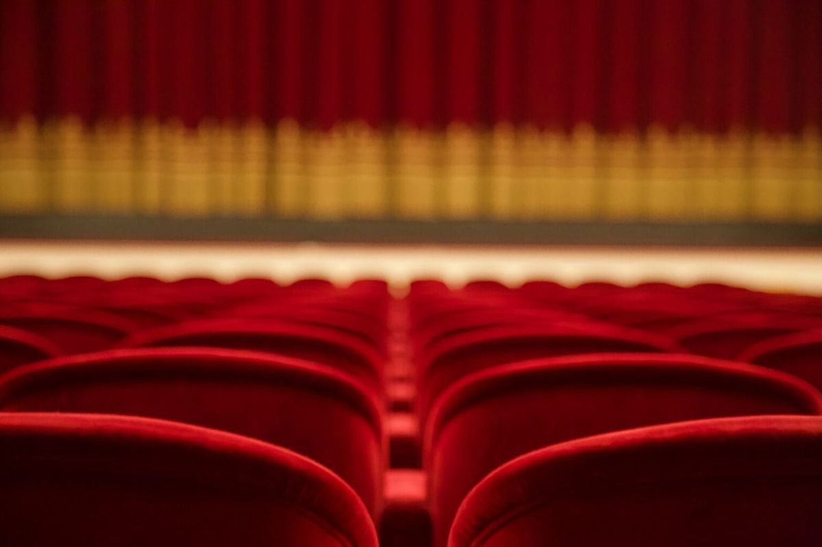 Red seats in a movie theatre.