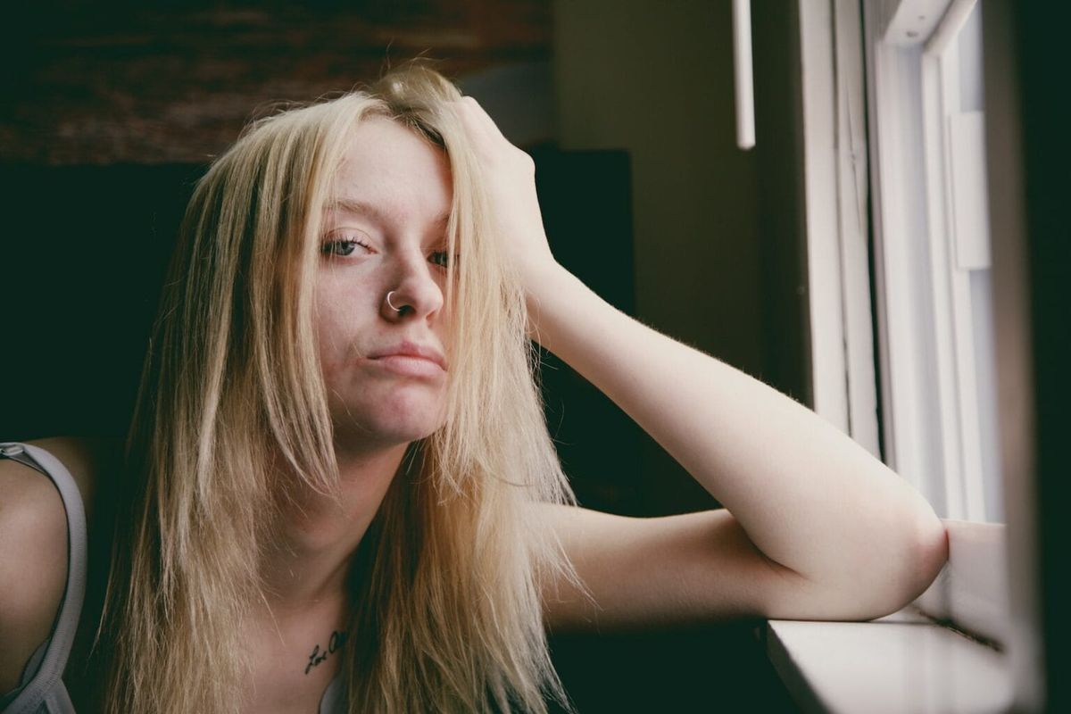 A bored woman staring at the lens
