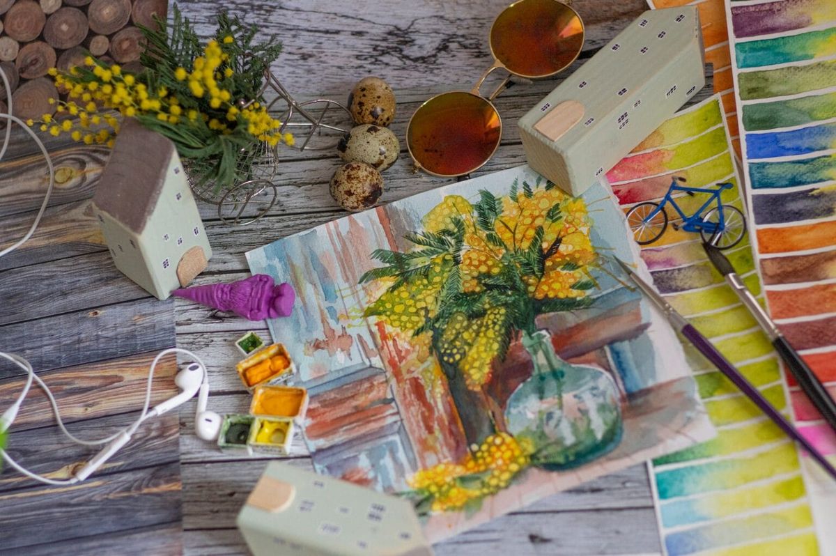 A painting of yellow flowers overlaid upon a table