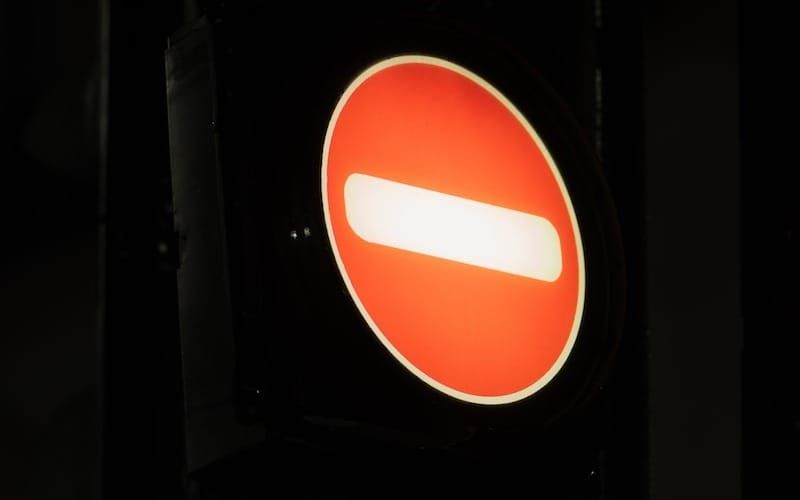 a close up of a traffic light with a red light