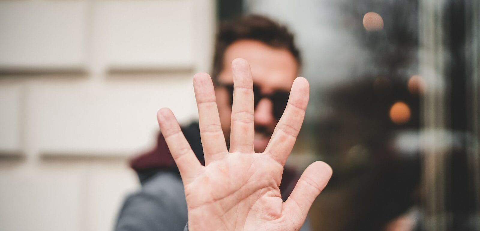 A man holding up his hand