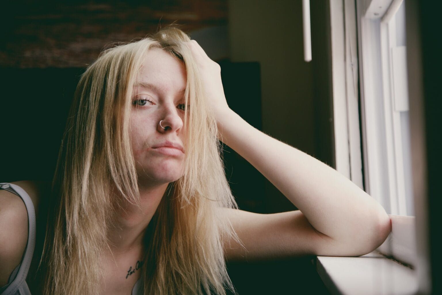 A bored woman staring at the lens