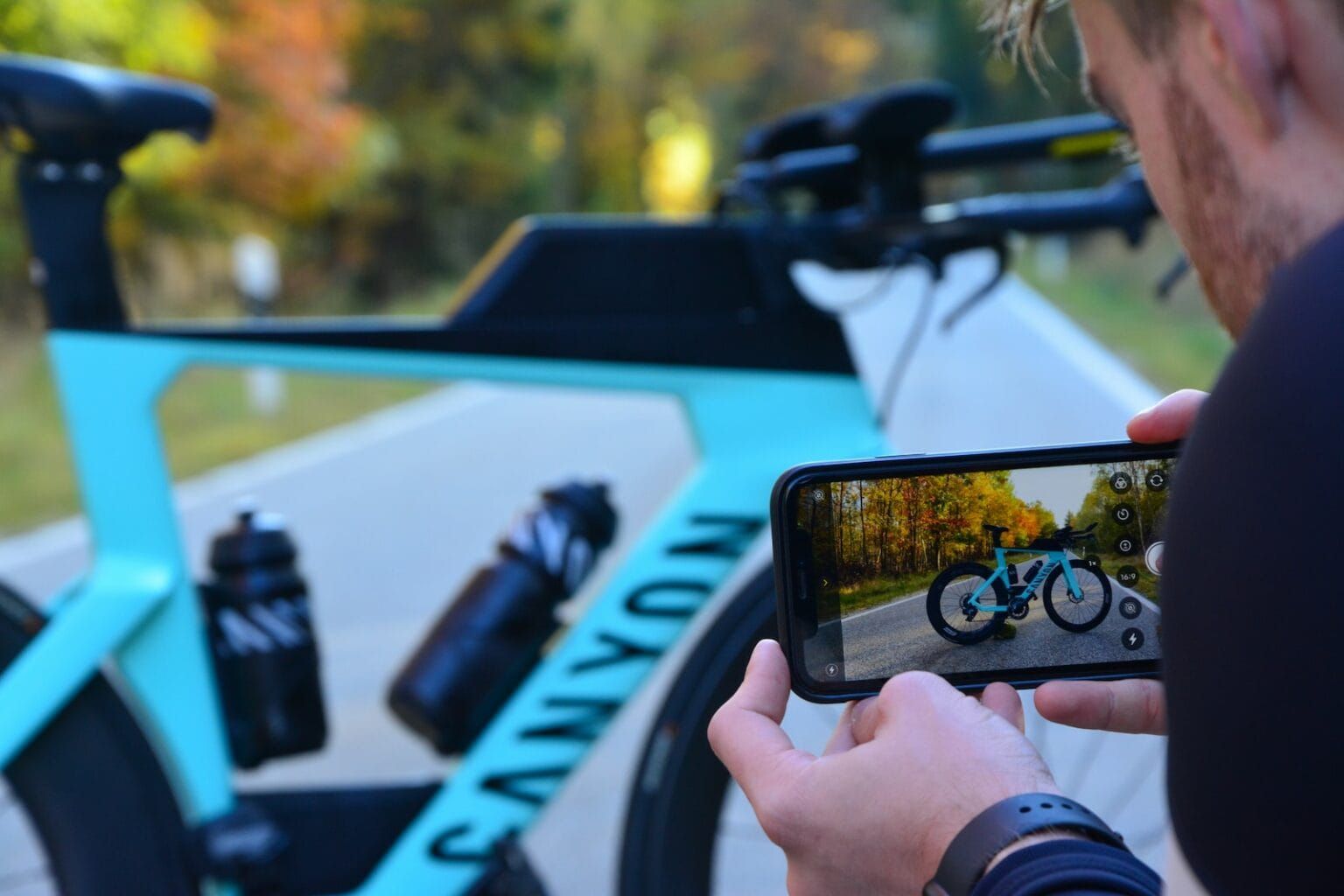 A man taking a photo of a bicycle