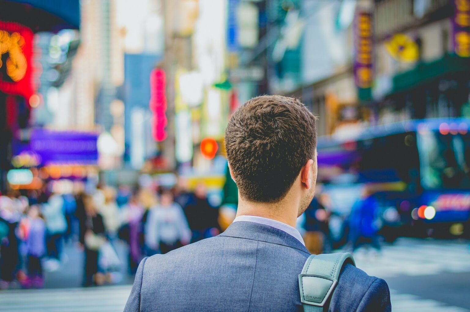 Shallow shoot photography of a man in suit's back