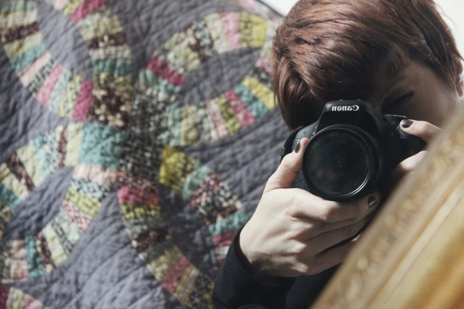 A child pointing a camera