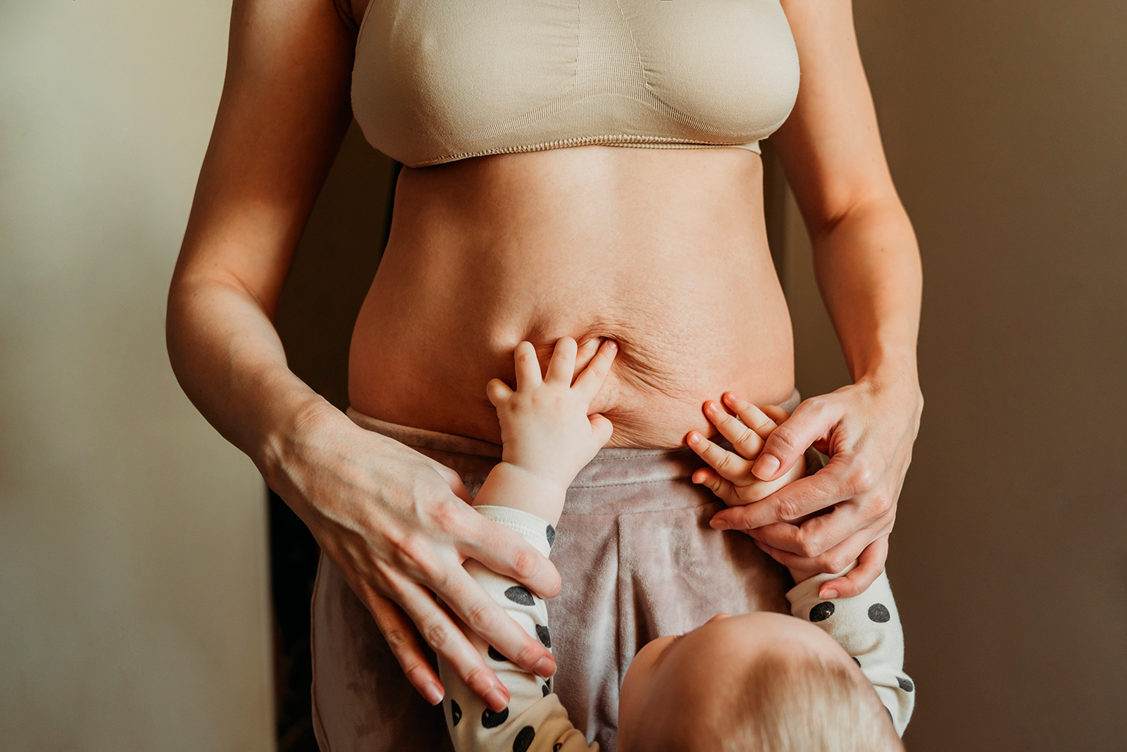 child holding mothers belly