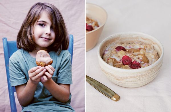 A child holding an apple and cinnamon cloud cookie beside a bowl of raspberry cinnamon porridge